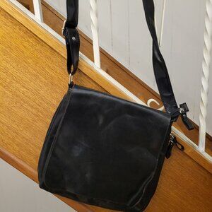 Black vegan leather cross body bag with pink lining